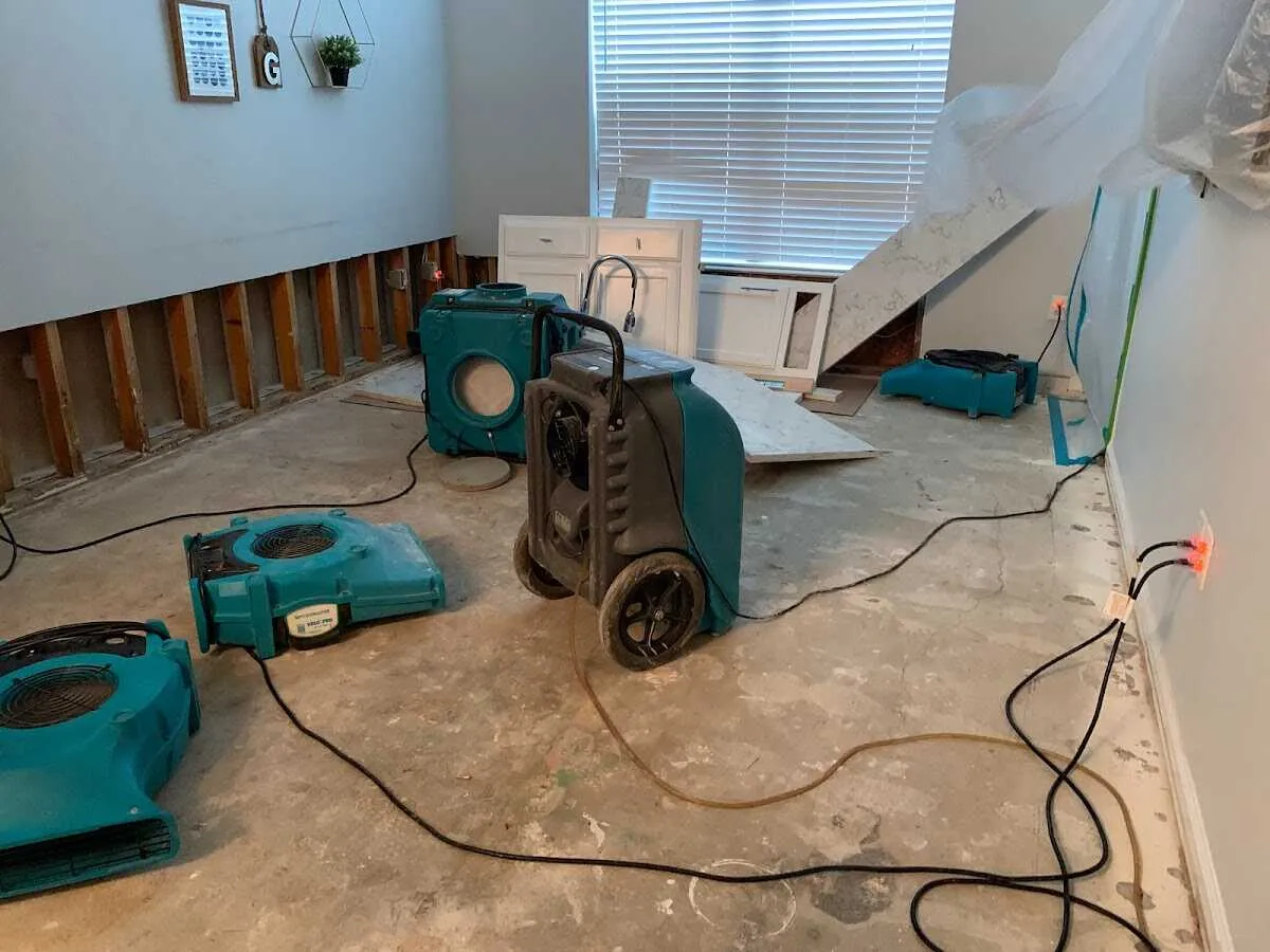 Dehumidifier in flood-cut room for Water Damage Restoration in Homewood